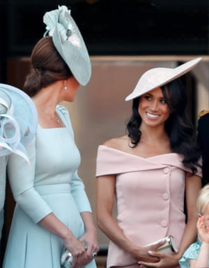 The Duchesses of Cambridge and Sussex as they carry the paint