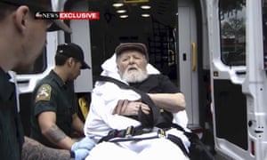 Jakiw Palij, a former Nazi concentration camp guard, is carried on a stretcher from his home in Queens, New York City.